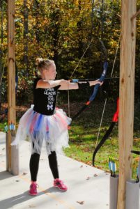 In typical Zoe style, you can't shoot a bow without a tutu. 